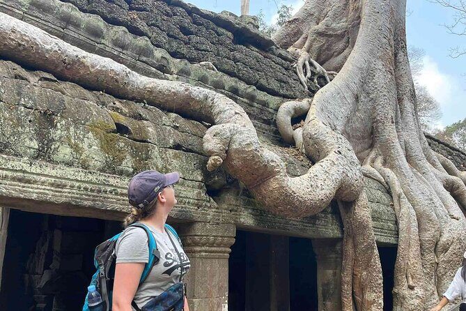 2-Day Phnom Penh to Siem Reap and Angkor Wat Temples - Angkor Thom walls, Bayon faces, and Jayavarman VII
