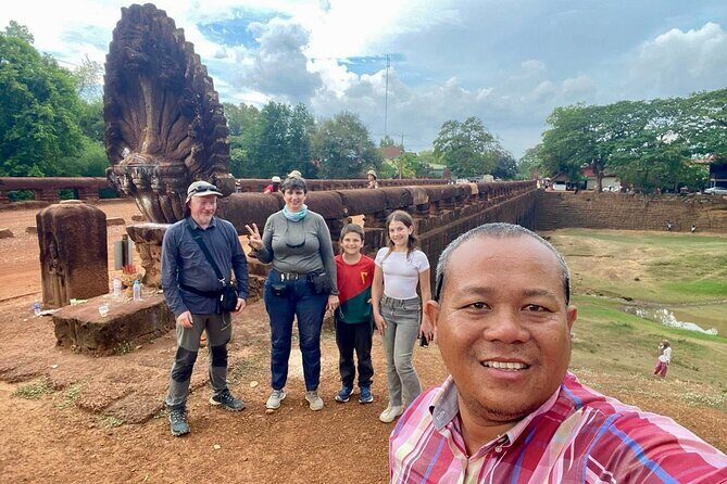 Full Day Tour Phnom Penh to Siem Reap Taxi, Angkor Visit & Return - Ta Prohm: the Tomb Raider temple, with tree roots doing the storytelling