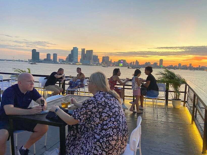 Phnom Penh: Mekong River Sunset Cruise with free flow drink - What the guide experience feels like during the cruise