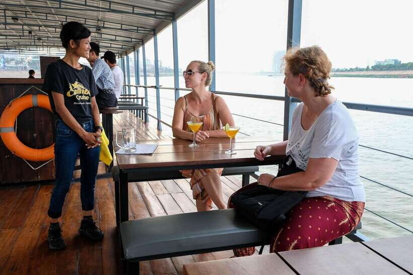 Phnom Penh: Mekong Sunset Dinner Cruise with Live Music - The boat experience: plush seating and a serious onboard kitchen