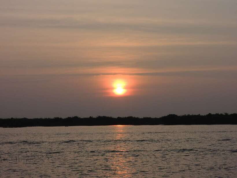 Phnom Penh to Siem Reap cruise/land tour (one way) - Tonle Sap River time: floating villages, stilt houses, and slow life