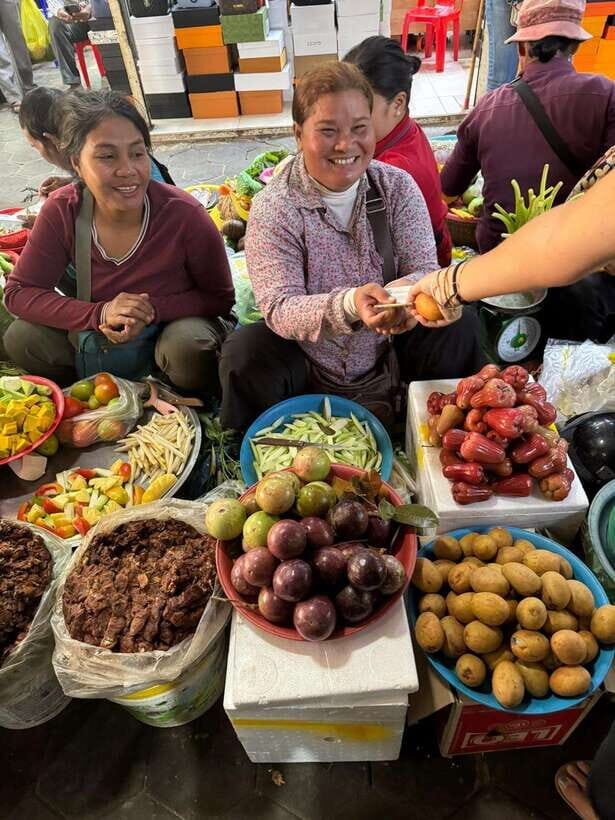 Phnom Penh's Ultimate Street Food Tour by Tuk Tuk - Stop 4: Russian Market food browsing with a guided hand