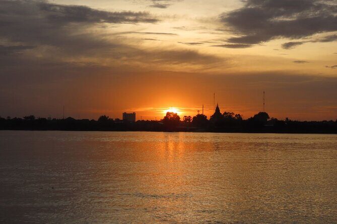 Silk Island at Twilight Cycle Encounter - Cycling beside the river: villages, plantations, and temple stops